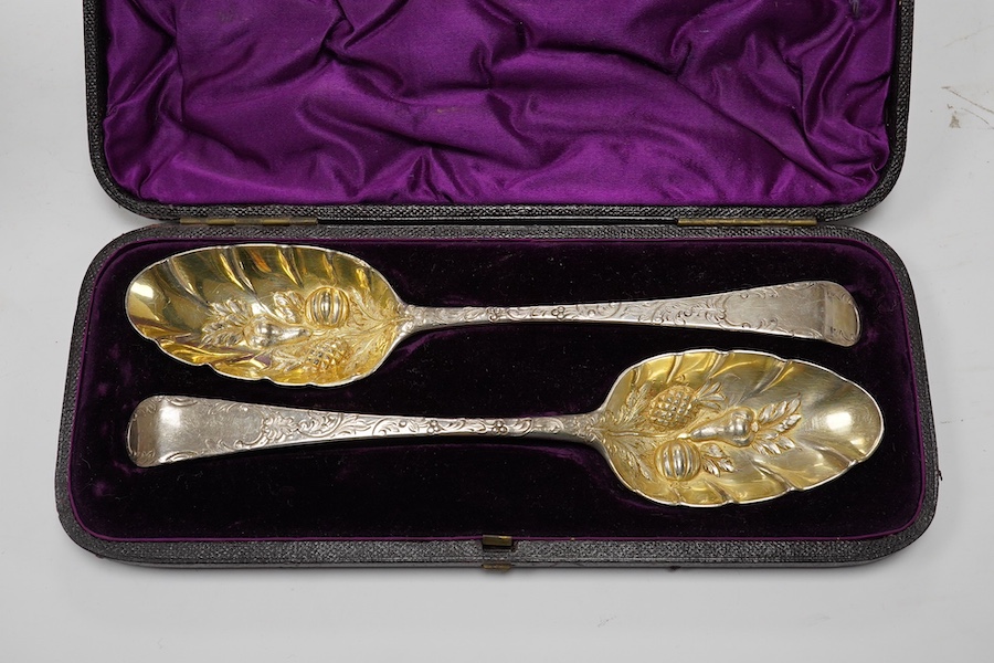 A 1960's silver Guernsey milk can, by Kenneth Tyler Key, height 16cm and two cased sets of spoons (one incomplete) including a pair of berry spoons by Thomas Eustace, Exeter, 1783. Condition - fair to good